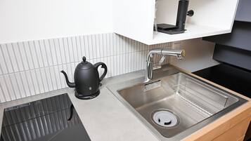 Full-sized fridge, microwave, stovetop, electric kettle