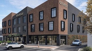 A modern building with 'QUEST' signage, large windows, and a parking area. - Quest Havelock North (Havelock North)