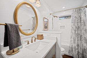 Shower, hair dryer, towels, toilet paper