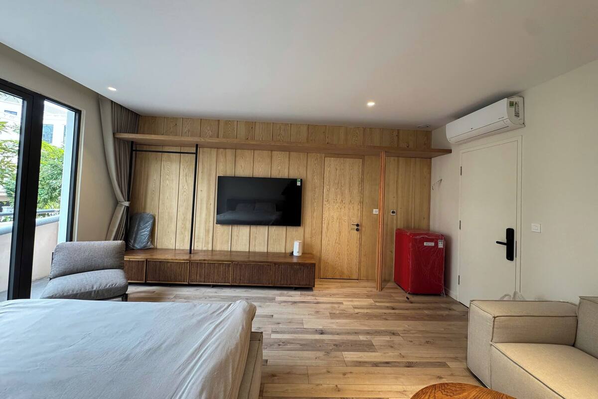 Chambre Deluxe, vue sur le jardin | Aire de séjour