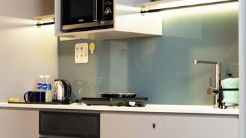 Junior Studio, 2 Twin Beds, City View | Private kitchen | Fridge, microwave