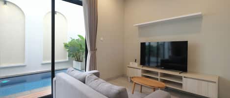 Deluxe Villa, 2 Bedrooms, Balcony, Garden View | Living area | Flat-screen TV