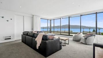 Panoramic Apartment, Ocean View | Living area | Flat-screen TV