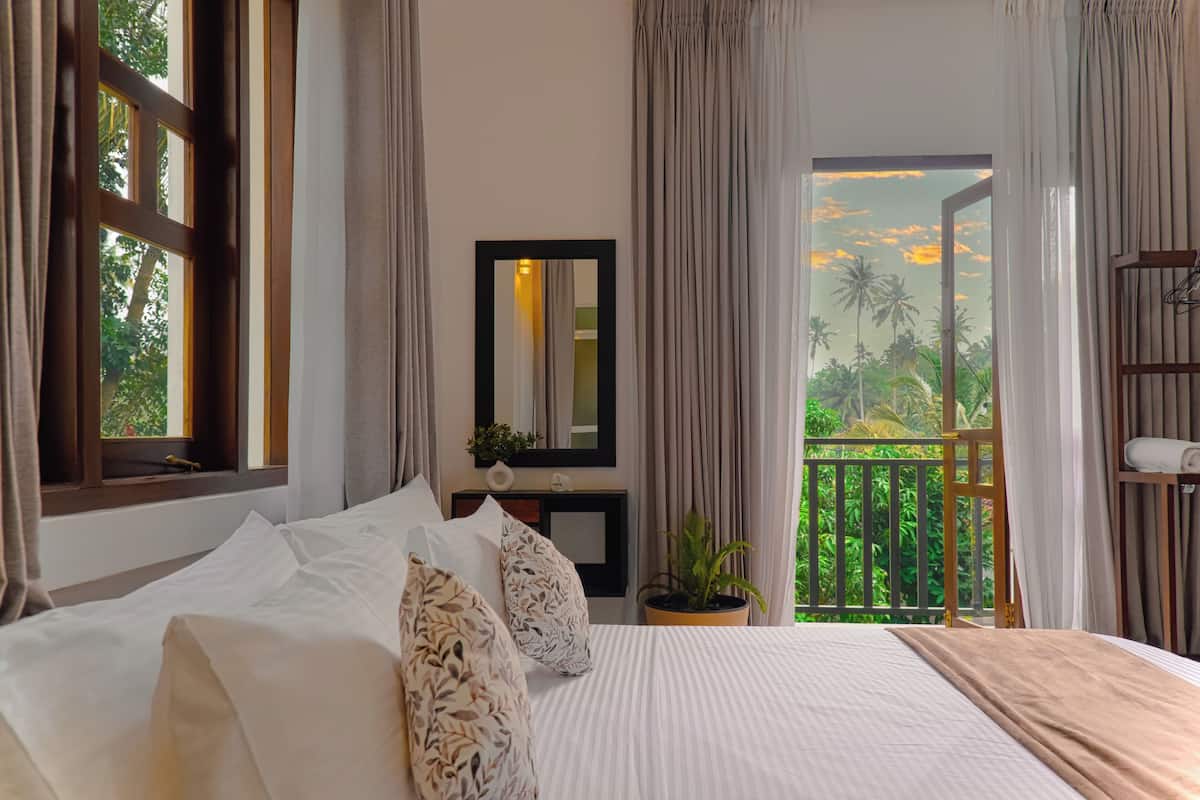 Deluxe Double Room, Garden View | Desk, laptop workspace, free WiFi, bed sheets