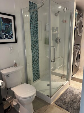 Shower, hair dryer, towels, soap