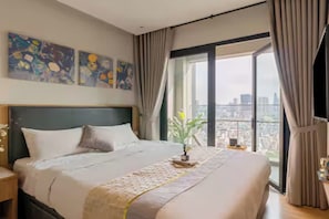 Presidential Suite, 2 Bedrooms, Club Lounge Access, City View | Egyptian cotton sheets, premium bedding, down comforters - Odela Luxstay Grand Manhattan Residence (Cau Ong Lanh)