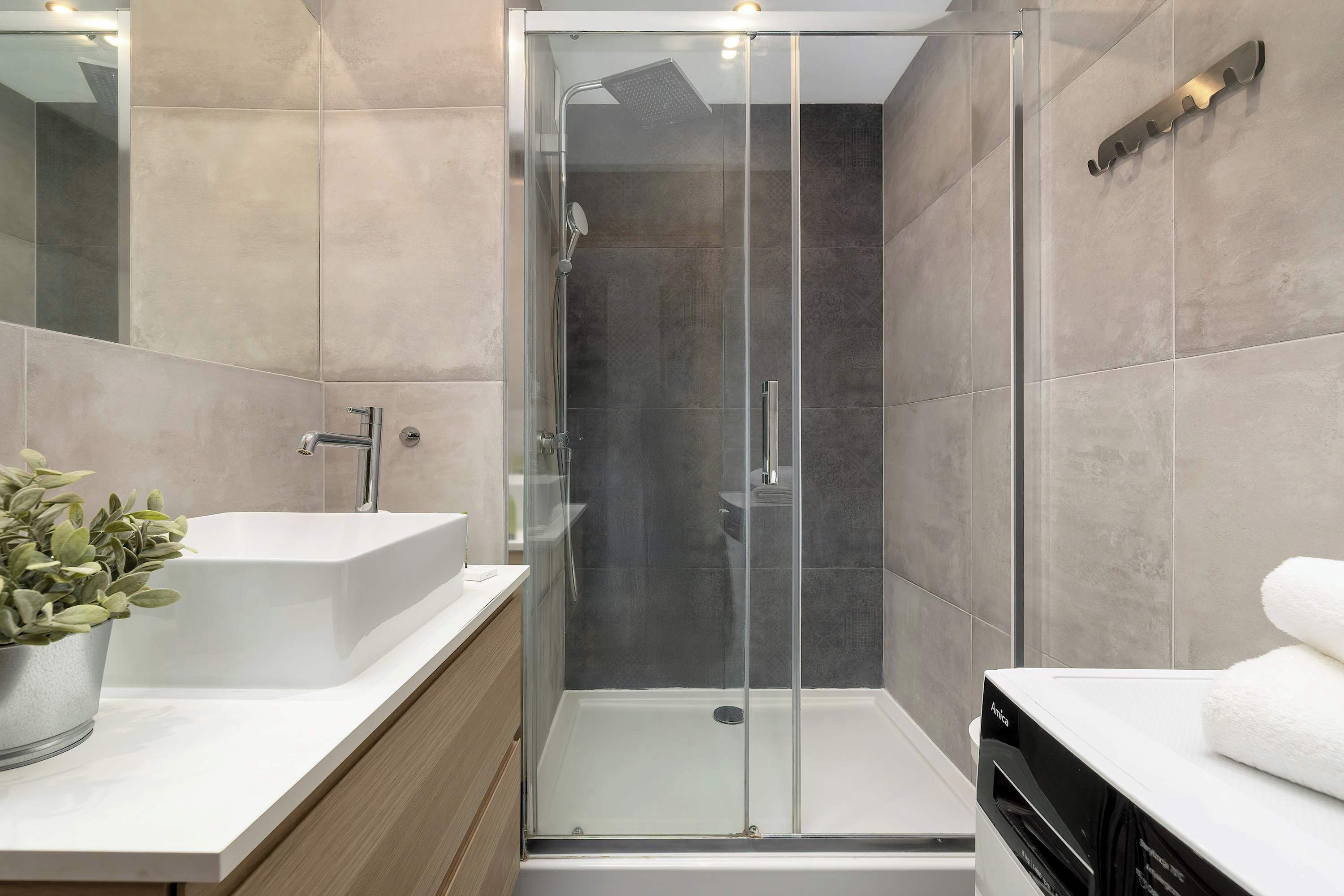 Shower, hair dryer, towels, shampoo