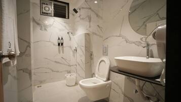 Shower, hair dryer, towels, soap