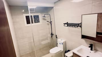 Shower, hair dryer, towels, soap