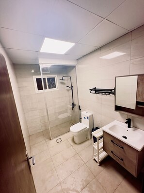 Shower, hair dryer, towels, soap