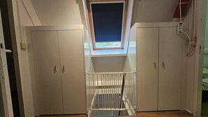 A room with a skylight, white wardrobes, and a power outlet on the wall. - Nature Retreat Close to Durbuy Town (Durbuy)
