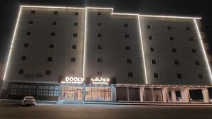 A hotel with a modern facade, multiple floors, and a prominent entrance. - Palette Luxury Doolv Serviced Apartments Tabuk (Tabuk)