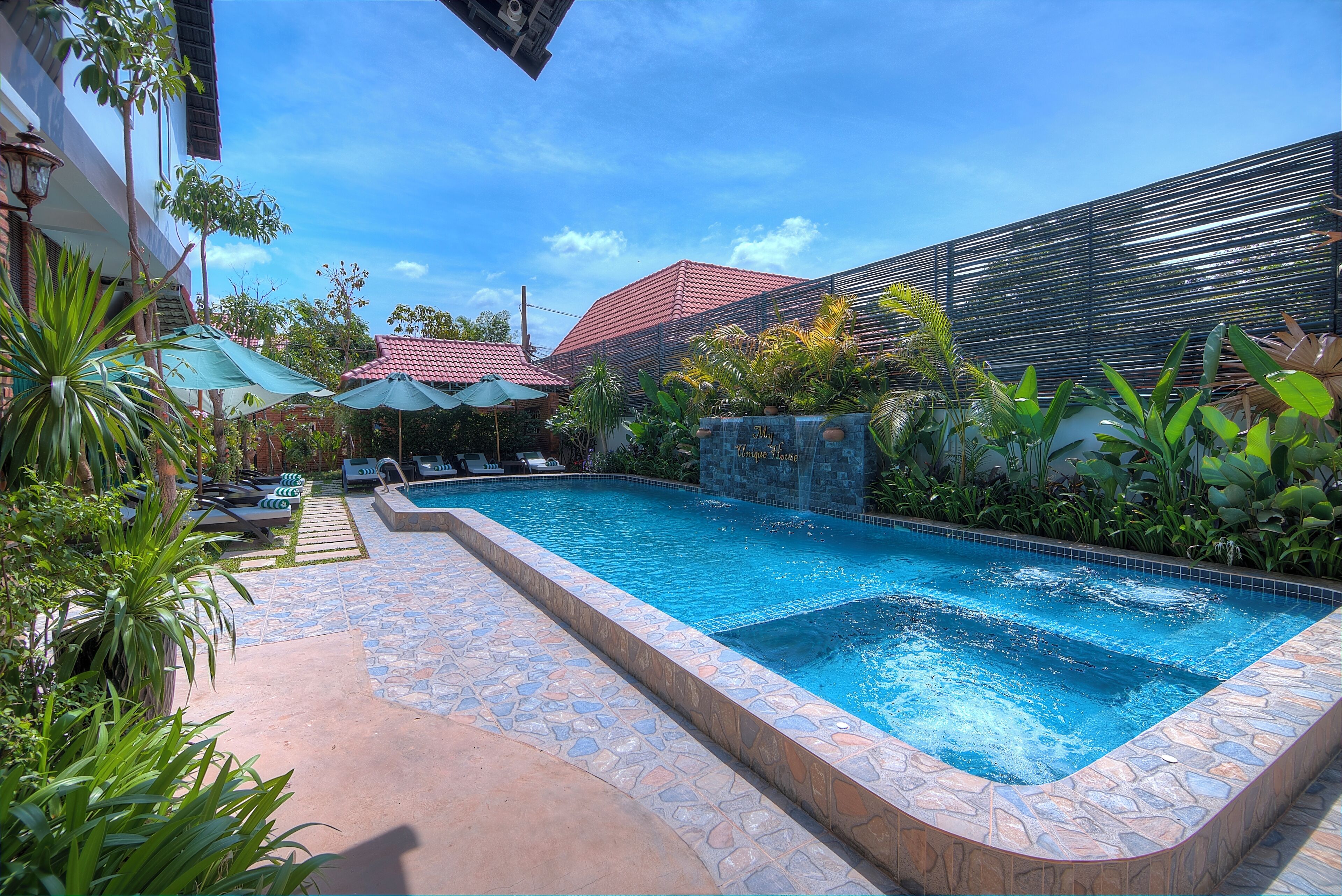 Indoor pool, open 8:00 AM to 9:00 PM, pool umbrellas