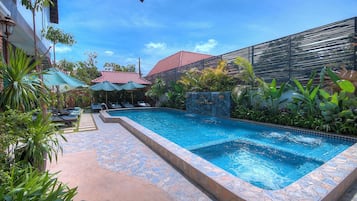 Indoor pool, open 8:00 AM to 9:00 PM, pool umbrellas