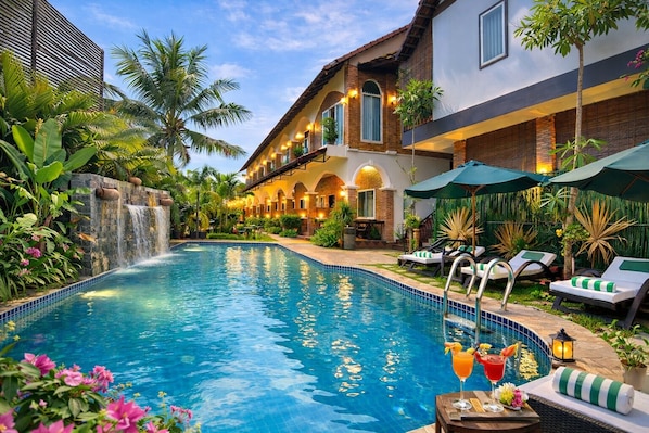 Indoor pool, open 8:00 AM to 9:00 PM, pool umbrellas