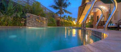 Indoor pool, open 8:00 AM to 9:00 PM, pool umbrellas