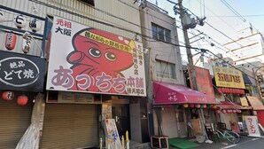 A street with closed shops, some with signs in a foreign language, and a bicycle parked outside one shop. - 30sec walk to Tsutenkaku/1 stop to Namba Sta./AH27 (Ebisu Higashi Naniwa-Ward,Osaka City,)