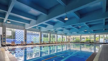 Indoor pool, seasonal outdoor pool, pool umbrellas, lifeguards on site