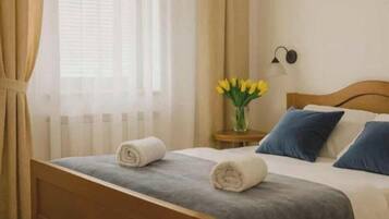 Premium bedding, desk, blackout drapes, soundproofing