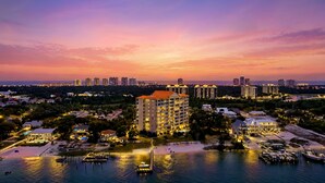A high-rise hotel with multiple floors, a marina with boats, and a beach area. - Sailmakers Place 903 | Two-Story Penthouse | Panoramic Views | My Beach Getaways (Pensacola)