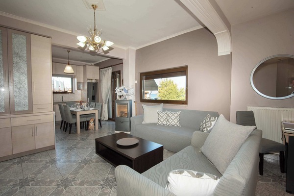 Inviting lounge space with a warm, homely atmosphere, offering comfort and privacy for peaceful evenings indoors.