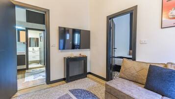 Apartment, 2Â Einzelbetten, Balkon, Stadtblick | Wohnzimmer