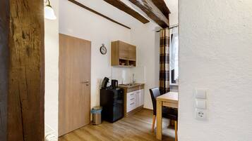 Fridge, stovetop, electric kettle, cookware/dishes/utensils