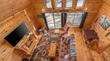 TV connectée, cheminée, lecteur de DVD, vidéothèque