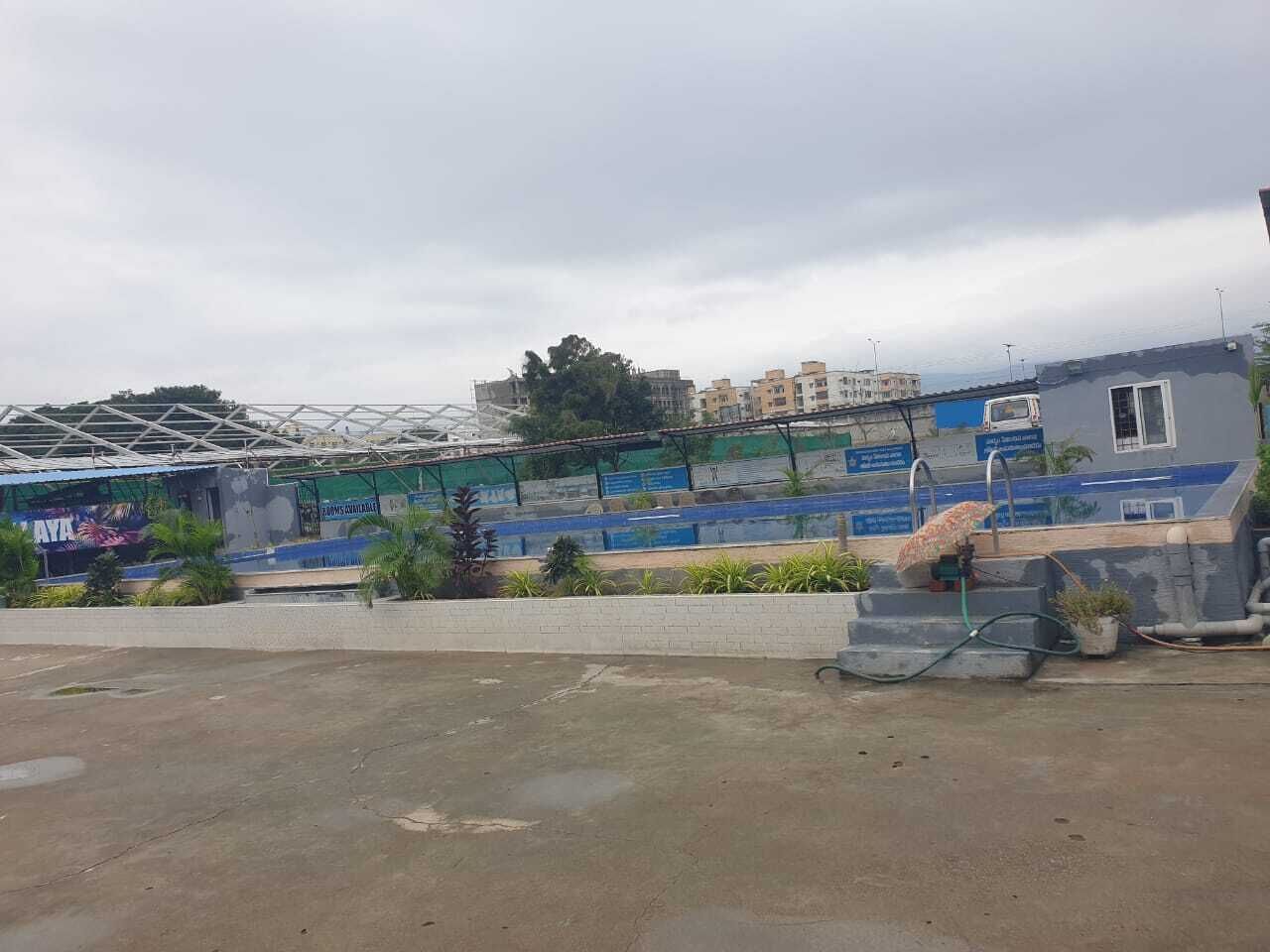 A parking lot with a building in the background.