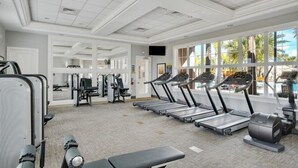 A gym with treadmills, weight machines, and a bench. - St5336ob Solterra Resort 5 Bedroom Home (Davenport)