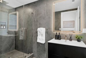 Shower, hair dryer, towels