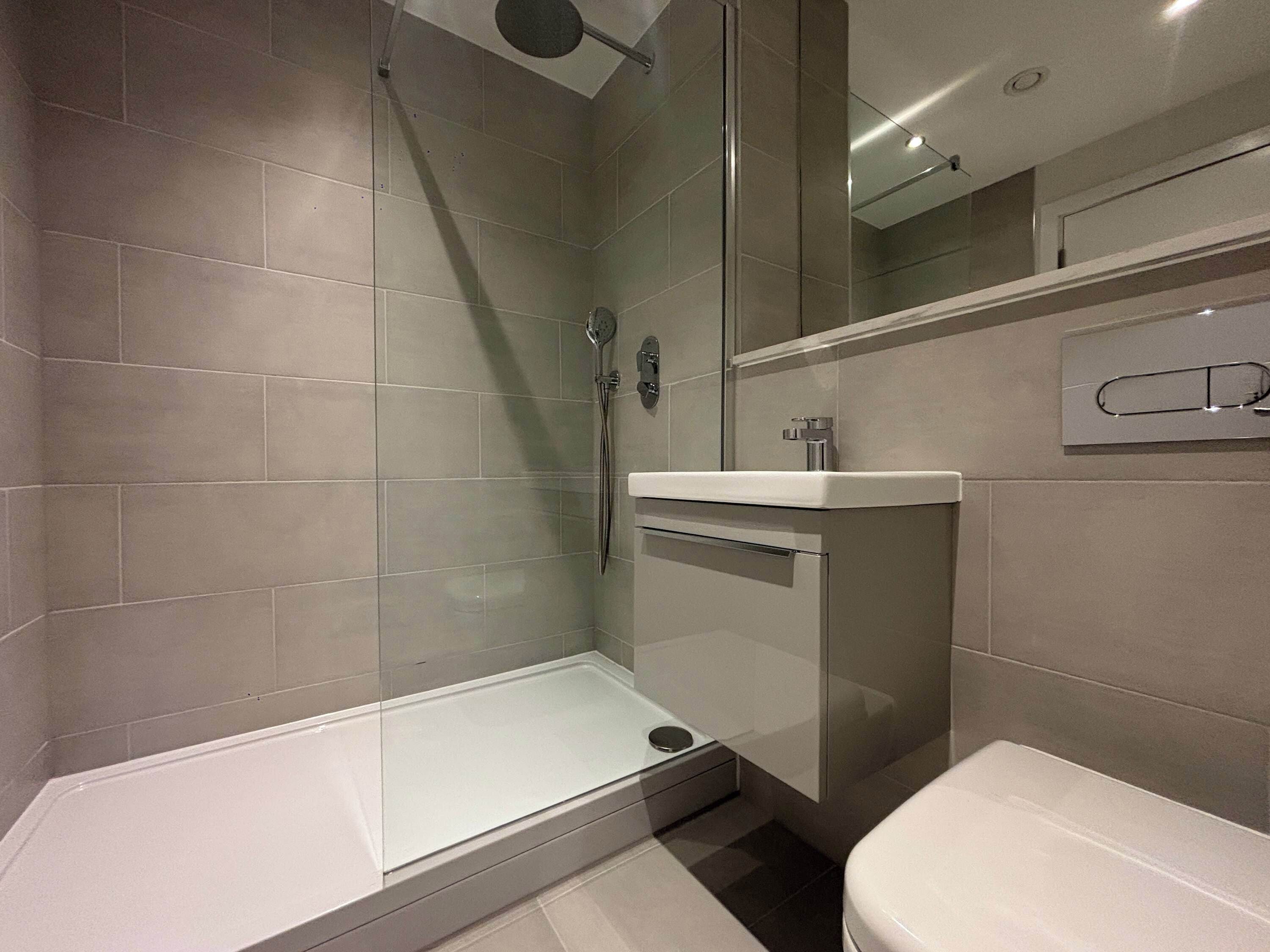 Shower, hair dryer, towels, shampoo