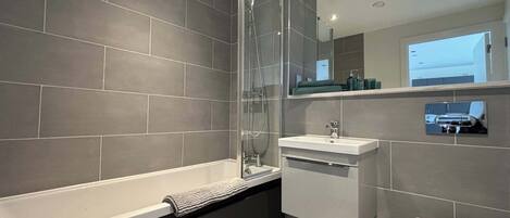 Shower, hair dryer, towels, shampoo