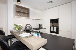 Fridge, microwave, oven, stovetop - Central Location with Easy Access to Al Khail Road, Near Bus Stops, Supermarkets, Dining Spots (Dubai)