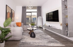 TV - Central Location with Easy Access to Al Khail Road, Near Bus Stops, Supermarkets, Dining Spots (Dubai)