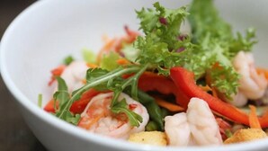 A bowl of salad with shrimp, vegetables, and greens. - Relaxing 1-bedroom resort with AC in peaceful Preah Sihanouk #4 (Preah Sihanouk,)