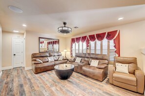 A spacious living room with a sectional sofa, a recliner, and a coffee table. - Luxury,5 Bed rooms,private pool /Spa Near Strip &Airport,15 %/25% Special offer! (Las Vegas)