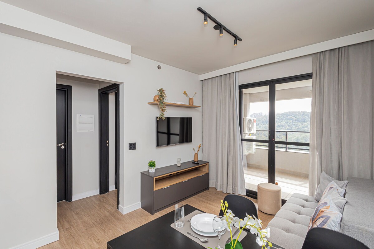 Family Apartment, City View | Living area | 42-inch Smart TV with digital channels