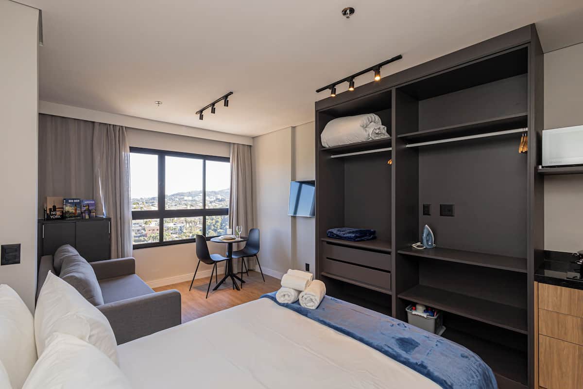 Deluxe Studio, City View | Laptop workspace, WiFi (free), bed sheets