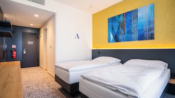 Coffres-forts dans les chambres, fer et planche Ă repasser