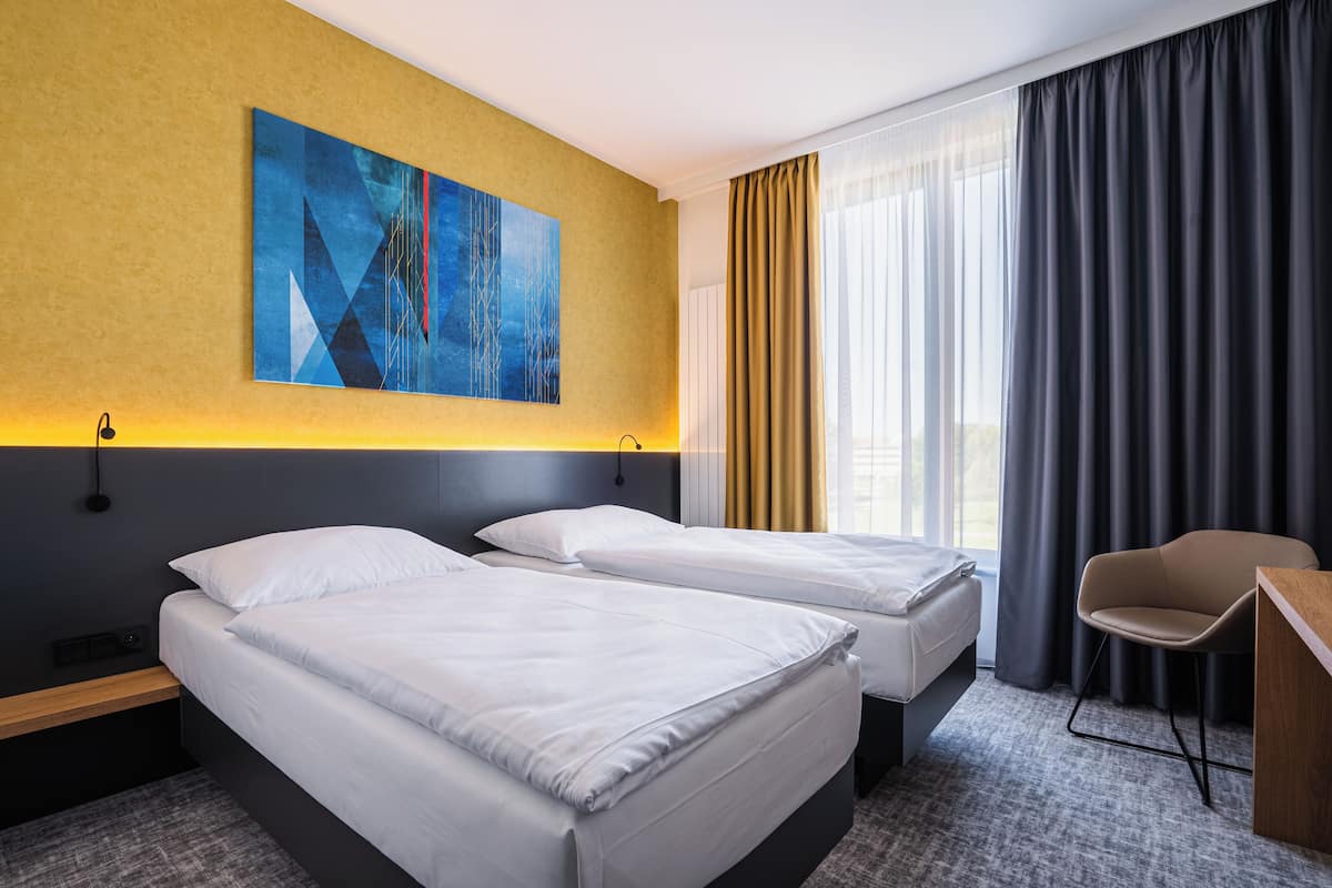 Twin kamer | Een kluis op de kamer, een strijkplank/strijkijzer, gratis wifi