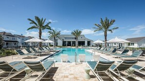 A pool area with lounge chairs and palm trees. - Landing | Modern 3BD, Gym, Yoga Studio (Four Corners)