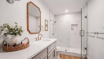 Shower, hair dryer, towels, shampoo