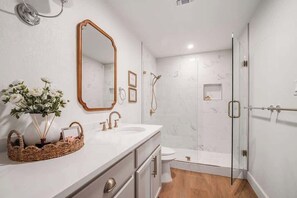 Shower, hair dryer, towels, shampoo