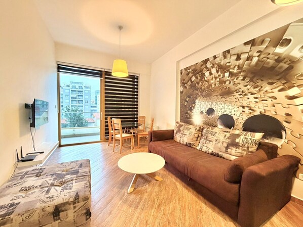 Appartement Supérieur, balcon, vue ville | Coin séjour