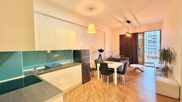 Deluxe Apartment, Balcony, City View | Private kitchen | Oven, stovetop, cookware/dishes/utensils
