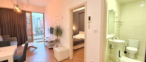 Deluxe Apartment, Balcony, City View | Living area | 42-inch LCD TV with cable channels