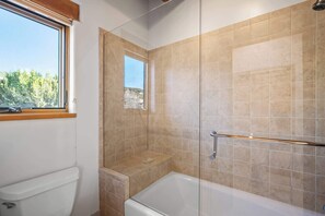 Shower, hair dryer, towels, shampoo
