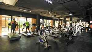 A gym with treadmills, stationary bikes, and weight machines. - Tuk Viento PH with Private Pool (Tulum)