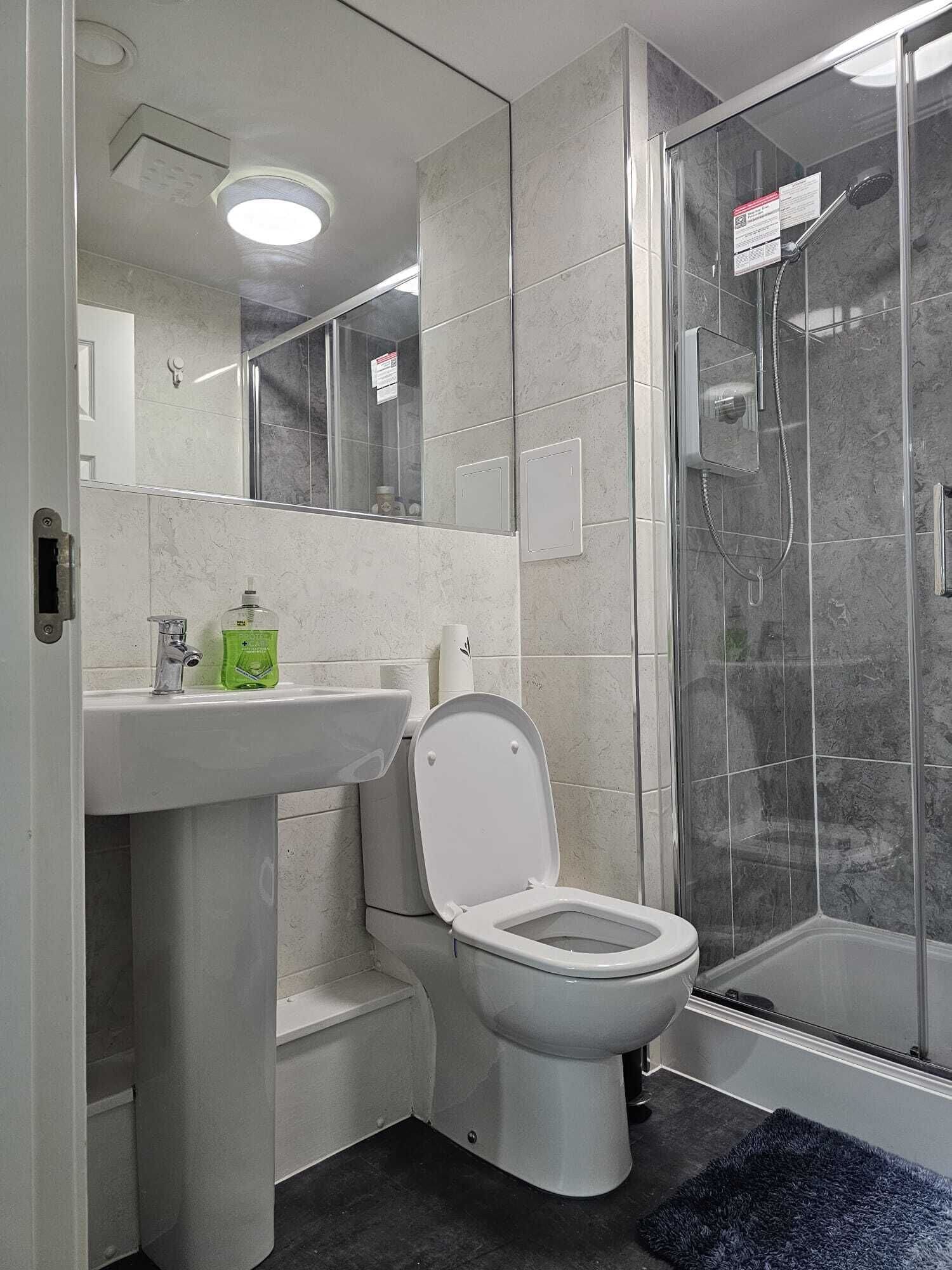 Shower, towels, toilet paper